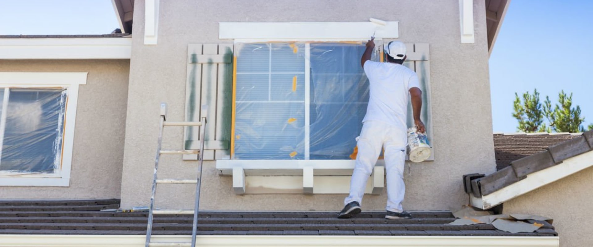 How many sq ft does a 5 gallon bucket of paint cover exterior?